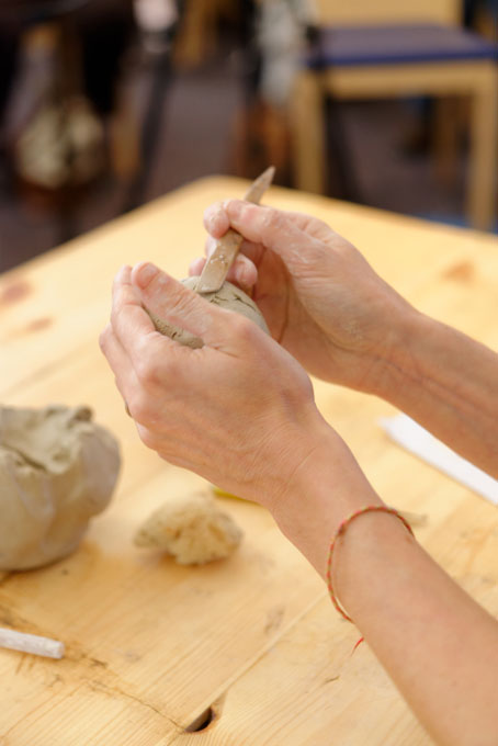 Sally MacDonell demonstrating the building of a face at Oxford Ceramics Fair 2013
