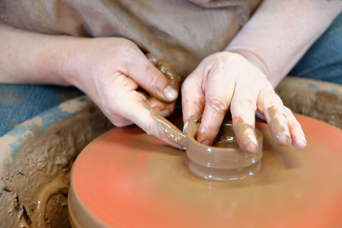 Paul Jessop at Barrington Pottery 2014 making small sauce pots