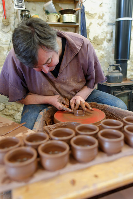 Paul Jessop at Barrington Pottery 2014 making small sauce pots