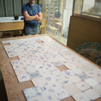 Tile making at Douglas Watson Studios - Dr Pete Spring hand cutting the tile blanks