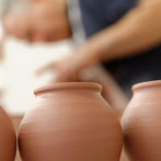 John and Jude Jelfs working together in their pottery in Bourton on the Water