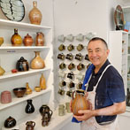 John and Jude Jelfs working together in their pottery in Bourton on the Water