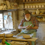 Muchelney Pottery 2014. John Leach’s pottery in Somerset. John turning plates