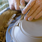 Muchelney Pottery 2014. John Leach’s pottery in Somerset. John turning plates