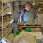 Muchelney Pottery 2014. John Leach’s pottery in Somerset. John turning plates