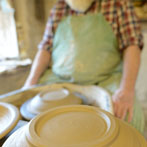 Muchelney Pottery 2014. John Leach’s pottery in Somerset. John turning plates