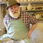 Muchelney Pottery 2014. John Leach’s pottery in Somerset. John turning plates
