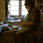 Muchelney Pottery 2014. John Leach’s pottery in Somerset. John turning plates
