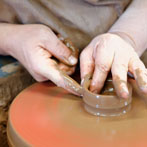 Paul Jessop at Barrington Pottery 2014 making small sauce pots