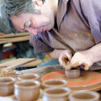Paul Jessop at Barrington Pottery 2014 making small sauce pots