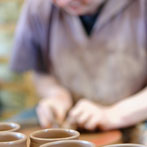 Paul Jessop at Barrington Pottery 2014 making small sauce pots