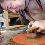 Paul Jessop at Barrington Pottery 2014 making small sauce pots