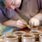 Paul Jessop at Barrington Pottery 2014 making small sauce pots