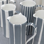 Sue Binns decorating in her studio in London 2013 - Cobalt is applied over a matt glaze.