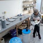 Sue Binns decorating in her studio in London 2013 - Cobalt is applied over a matt glaze.