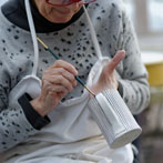 Sue Binns decorating in her studio in London 2013 - Cobalt is applied over a matt glaze.