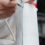 Sue Binns decorating in her studio in London 2013 - Cobalt is applied over a matt glaze.