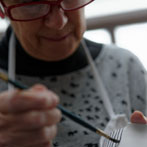 Sue Binns decorating in her studio in London 2013 - Cobalt is applied over a matt glaze.