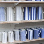Sue Binns decorating in her studio in London 2013 - Cobalt is applied over a matt glaze.