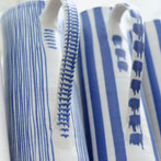 Sue Binns decorating in her studio in London 2013 - Cobalt is applied over a matt glaze.