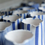 Sue Binns decorating in her studio in London 2013 - Cobalt is applied over a matt glaze.