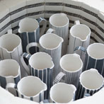 Sue Binns decorating in her studio in London 2013 - Cobalt is applied over a matt glaze.