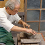 Tozan Kimura, the 17th generation of his family to head the Tokeido Pottery in Imbe, Okyama Prefecture, the centre of Bizen Yaki pottery manufacture.  After a rather awkward discussion, since he speaks virtually no English and I no Japanese he stopped what he was doing and made 3 pots to so us how he works.   