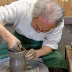 Tozan Kimura, the 17th generation of his family to head the Tokeido Pottery in Imbe, Okyama Prefecture, the centre of Bizen Yaki pottery manufacture.  After a rather awkward discussion, since he speaks virtually no English and I no Japanese he stopped what he was doing and made 3 pots to so us how he works.   