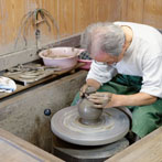 Tozan Kimura, the 17th generation of his family to head the Tokeido Pottery in Imbe, Okyama Prefecture, the centre of Bizen Yaki pottery manufacture.  After a rather awkward discussion, since he speaks virtually no English and I no Japanese he stopped what he was doing and made 3 pots to so us how he works.   