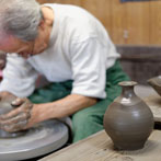 Tozan Kimura, the 17th generation of his family to head the Tokeido Pottery in Imbe, Okyama Prefecture, the centre of Bizen Yaki pottery manufacture.  After a rather awkward discussion, since he speaks virtually no English and I no Japanese he stopped what he was doing and made 3 pots to so us how he works.   