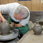 Tozan Kimura, the 17th generation of his family to head the Tokeido Pottery in Imbe, Okyama Prefecture, the centre of Bizen Yaki pottery manufacture.  After a rather awkward discussion, since he speaks virtually no English and I no Japanese he stopped what he was doing and made 3 pots to so us how he works.   