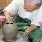 Tozan Kimura, the 17th generation of his family to head the Tokeido Pottery in Imbe, Okyama Prefecture, the centre of Bizen Yaki pottery manufacture.  After a rather awkward discussion, since he speaks virtually no English and I no Japanese he stopped what he was doing and made 3 pots to so us how he works.   