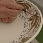 Laurence McGowan decorating a plate